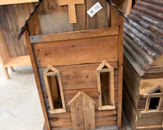 Handmade rustic church birdhouses with tin roofs.
