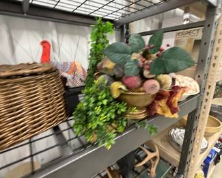 Easter and spring decor: ceramic chicks and ducks, baskets, and faux florals.