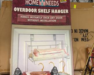Over-the-door shelf hanger, new in box.