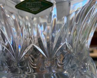 Cut crystal vase with maker's label.