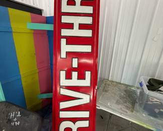 Red and white DRIVE-THRU sign.
