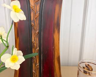 Wood-tone vase with florals.