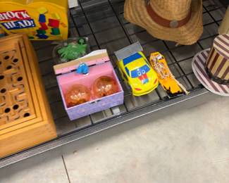 Wooden marble maze, toy car, and games.