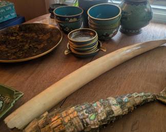 Vintage Chinese pottery, metallic fishes, and tusks