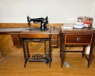 Singer Treadle Sewing Machine in Wood Cabinet with Cast Iron Base - A Singer treadle sewing machine in a wood cabinet with drawers on each side and a cast iron Singer base. A good piece for vintage sewing fans.