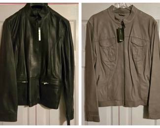 Black Leather Zip Jacket and Taupe Zip Jacket with Tags Attached - A black leather zip jacket with zip pockets and a taupe zip jacket with two chest pockets, both with the store tags still attached. A good pair for jacket shoppers.