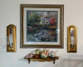 Gold Framed Gazebo Print, Gold Arched Mirror Sconces and Swan Figurine Shelf - A framed gazebo and swan pond print, a pair of gold arched mirror wall sconces with glass hurricane shades, and a carved wall shelf holding swan figurines and a swan snow globe. A good lot for living room wall decor.