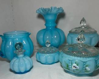 Fenton Blue Overlay Hand Painted Pitcher, Vase, Perfume Bottle and Covered Jars - A Fenton blue overlay pitcher, a ruffled vase, a stoppered perfume bottle, and two covered jars with clear finials, including one with hand painted flowers. A good lot for Fenton collectors.