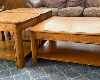 Oak Coffee Table and End Tables with Lower Shelves - An oak coffee table with a matching pair of end tables, each with a lower shelf. A good living room set.