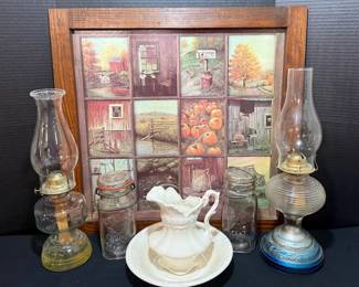 Glass Oil Lamps, Atlas and Ball Canning Jars, Ruffled Pitcher and Basin with Framed Country Window Print - Two glass oil lamps with chimneys, an Atlas Good Luck jar and a Ball Ideal jar with wire bail lids, a white ruffled pitcher and wash basin, and a framed window pane style print with barn and pumpkin scenes. A good lot for farmhouse and autumn decor.