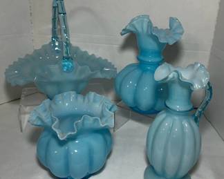 Fenton Blue Overlay Basket, Melon Rib Pitcher and Ruffled Vases - A Fenton blue overlay basket with a twisted handle, a melon rib pitcher, and two ruffled vases. A nice grouping for a glass display.