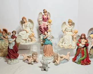 Porcelain Angel and Cherub Figurines, Harp Angel and Reclining Cherubs - A group of porcelain angel figurines, some holding or sitting with cherubs, plus an angel with a harp, two reclining cherubs, and a small lamb. A nice lot for angel collectors.
