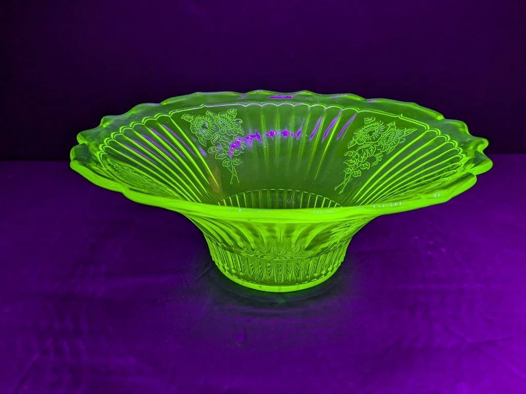 Lot 571: Uranium glass centerpiece bowl, glowing under UV light