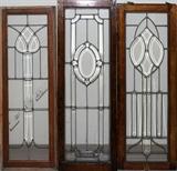 Lot#138, LEADED BEVEL GLASS WINDOWS C1900 3 PCS. H 46" & 47" W 15"three windows, two 46" H. x 15" W. one 47" H. all having beveled leaded glass with central medallions and wood frames.