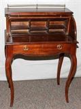 Lot#148, MAHOGANY LADY'S ROLL TOP WRITING DESK, H 38", L 28", D 17"Brass gallery around the top.  Brass ring pulls, pull out writing surface and one drawer with kneehole interior.