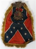 Lot#224, CONFEDERATE, U. C. V., SILK AND GILT METAL, REUNION PIN, 1927, H 8"U.C. V. (United Confederate Veterans) reunion ribbon, having a miniature Confederate flag with gold embroidered fringe attached to a medallion with the likeness of Robert E. Lee and a red enamel painted Confederate battle flag and inscribed: "UCV  Gen. Edmund Kirby Smith 37th Reunion, Tampa, 1927" and having crossed Rifles over olive branches and an anchor with the Roman numerals I X & X I on each side;