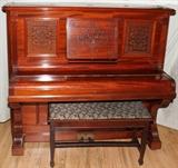 Lot#247, VOSE AND SONS (BOSTON), UPRIGHT "CABINET GRAND" PIANO, CARVED MAHOGANY, H 57", W 28", L 63"upright design; pierced upper panel and carved music rack;  Vose and Sons brass plate on string board; #20622. early 20th c; includes a bench with seat cushion.   Good Condition.