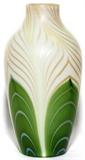 Lot#1010, STEUBEN DECORATED AURENE GLASS VASE, H 7"Alabaster ground with pulled green feather motif with gold and silver accents.  Signed "Aurene 598" at the underside (see additional photo).  Reference: "The Glass of Frederick Carder", Paul V. Gardner, copyright 1971, Crown Publishers, New York, catalog line number 598 (p.253).  Early 20th century.