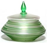 Lot#1033, STEUBEN VERRE DE SOIE GLASS DRESSER JAR WITH GREEN THREADING, H 3 1/2", DIA 4Verre de soie glass jar with green threading about, the cover centered by a green finial.  Not signed.  Circa 1920s.  Reference: "The Glass of Frederick Carder", Paul V. Gardner, copyright 1971, Crown Publishers, New York, catalog number 6600 (p.245).