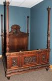 Lot#1127, AUSTRIAN CARVED WALNUT BED, C. 1870, H 103", W 66", L 84"Carved walnut headboard, footboard and side rails, with canopy, motif of dragon, cornucopia, and lion's heads.  Purportedly belonged to the Archduke of Austria.