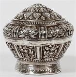 Lot#1191, REPOUSSE SILVER BOX, PROBABLY INDIAN, DIA 3 1/2"A round box with repousse floral motifs, no apparent markings.  Measures H.3 1/2", Dia.3 1/2".  Weighs approximately 3.7 troy oz.