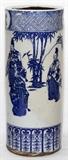 Lot#1209, JAPANESE BLUE & WHITE IMARI PORCELAIN VASE, C. 1800, H 11", DIA 4 1/4"Cylindrical shape hat vase decorated in blue with figures among bamboo. Unglazed lower rim. Unusual imari hand decoration.