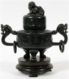 Lot#1238, CHINESE HARD STONE COVERED URN, H 6", W 7": Black hard stone. Foo dog finial. Base carved from one piece. Both handles have been repaired. Chs