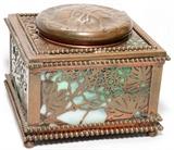 Lot#1265, TIFFANY STUDIOS ETCHED METAL & GLASS INKWELL WITH GRAPEVINE DESIGN, H 3 1/4", W 4 1/8": Etched metal frame with grapevine design backed by green glass panels. Stamped "Tiffany Studios New York 44" at the underside (see additional photo). One glass panel is chipped. Jw