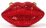 Lot#1381, KATHRINE BAUMANN RED LIPS COIN PURSE, W 3"Full bead red crystal lips, hinges open to gold leather lining.  Labeled: Kathrine Baumann Collectibles, Beverly Hills. Measures W. 3" x 1 1/2".