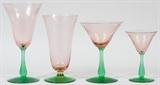 Lot#1434, STEUBEN STYLE PINK & GREEN GLASS STEMWARE, 18 PIECES,Including four champagne H 6", five goblets H 6 1/2", five liqueur H 5" and four white wine H 7 1/2".