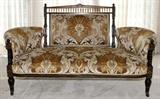 Lot#1484, EASTLAKE SETTEE, LATE 19TH C., H 35", L 67"Upholstered back with spindle arcade, flanked by upholstered arms, raised on turned supports with gilt accents.