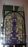 There are many beautiful pieces of stain glass in the windows of the house -which are to remain with the house- however, this piece is inside and is to be sold - wonderful piece - great colors.