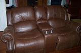 Really nice pair of real leather recliners. Note the piece in the center with the two cup/drink holders