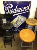 Piedmont porcelain sign, cutco fold out stool and two industrial style work stools. 