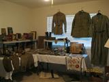 First bedroom on left has Army Paratrooper's WW II jump suits, jackets, knapsacks, boots, etc along with his 1920's child's football uniform and books, etc.