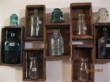Old strawberry boxes with antique bottles & jars