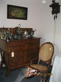 Antique oak sideboard with antique quadruple plate pieces