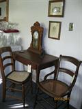 Antique kitchen mantle clock, oak table/desk & antique cane-seat chairs