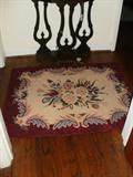 One of several hand-hooked rugs