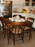 Bamboo motif oak table, oak chairs w/ caned seats