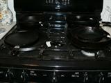 Many seasoned cast iron skillets, etc.