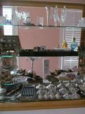 Pretty "stuff" in showcase includes sterling items, crystal & gold items