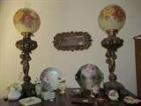 Hand painted globes on antique cupid oil lamps