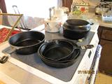 Vintage seasoned cast iron skillets incl. rare Wagner 2-skillet set