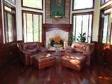Leather chairs with ottomans
