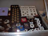 A sample of collectible coins & medals in one of the display cases