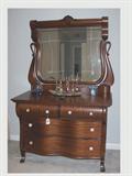 Mahogany serpentine front dresser w/ swan or goose neck mirror and shell crest