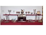 Display table with Crystal pcs., Silver Holloware pcs., & Chest with "Chantilly" 62 Pc. Flatware set.