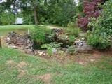 Peaceful Koi pond on property (not for sale) goes with house