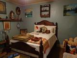 Antique rope bed, quilts etc